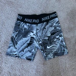 grey and black palm tree nike pros